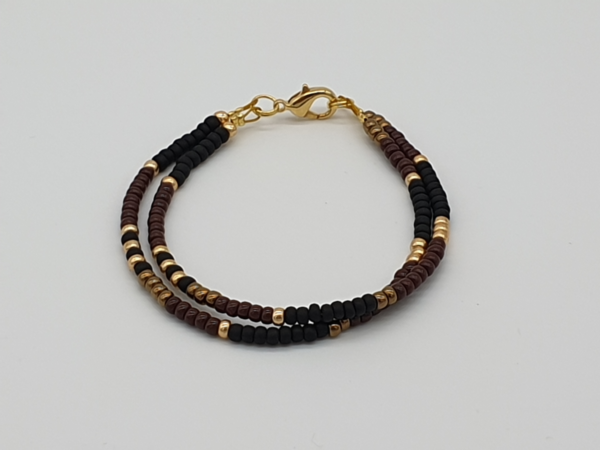 Perlenarmband schwarz ,braun und gold  Legiert